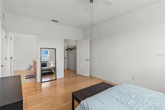 a bedroom with a bed and a table