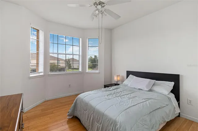 a bedroom with a bed and window