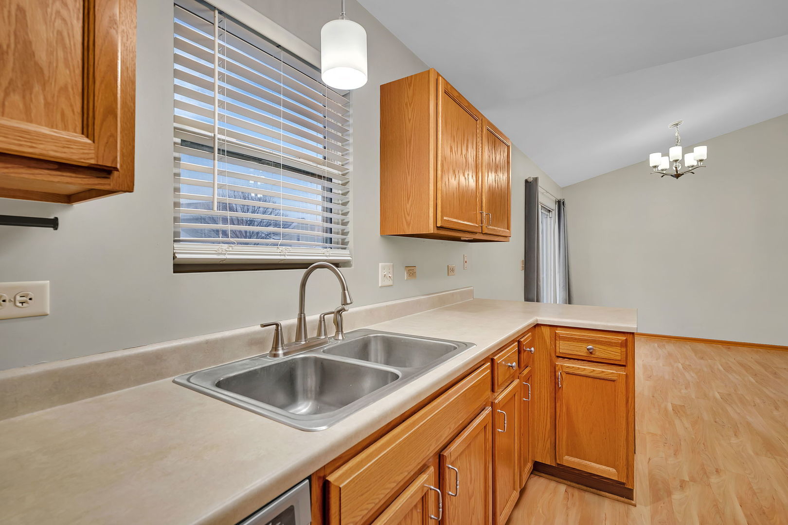 1640 Clover Court Romeoville, IL 60446 - Photo 12 of 30 a kitchen with a sink cabinets and window