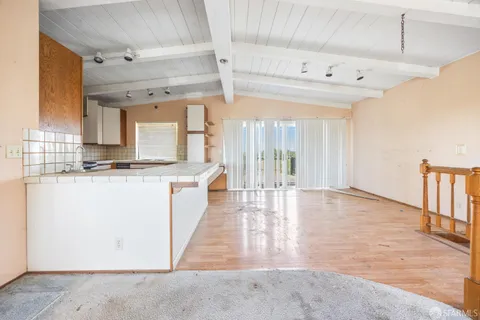 a view of house with wooden floor and outdoor space