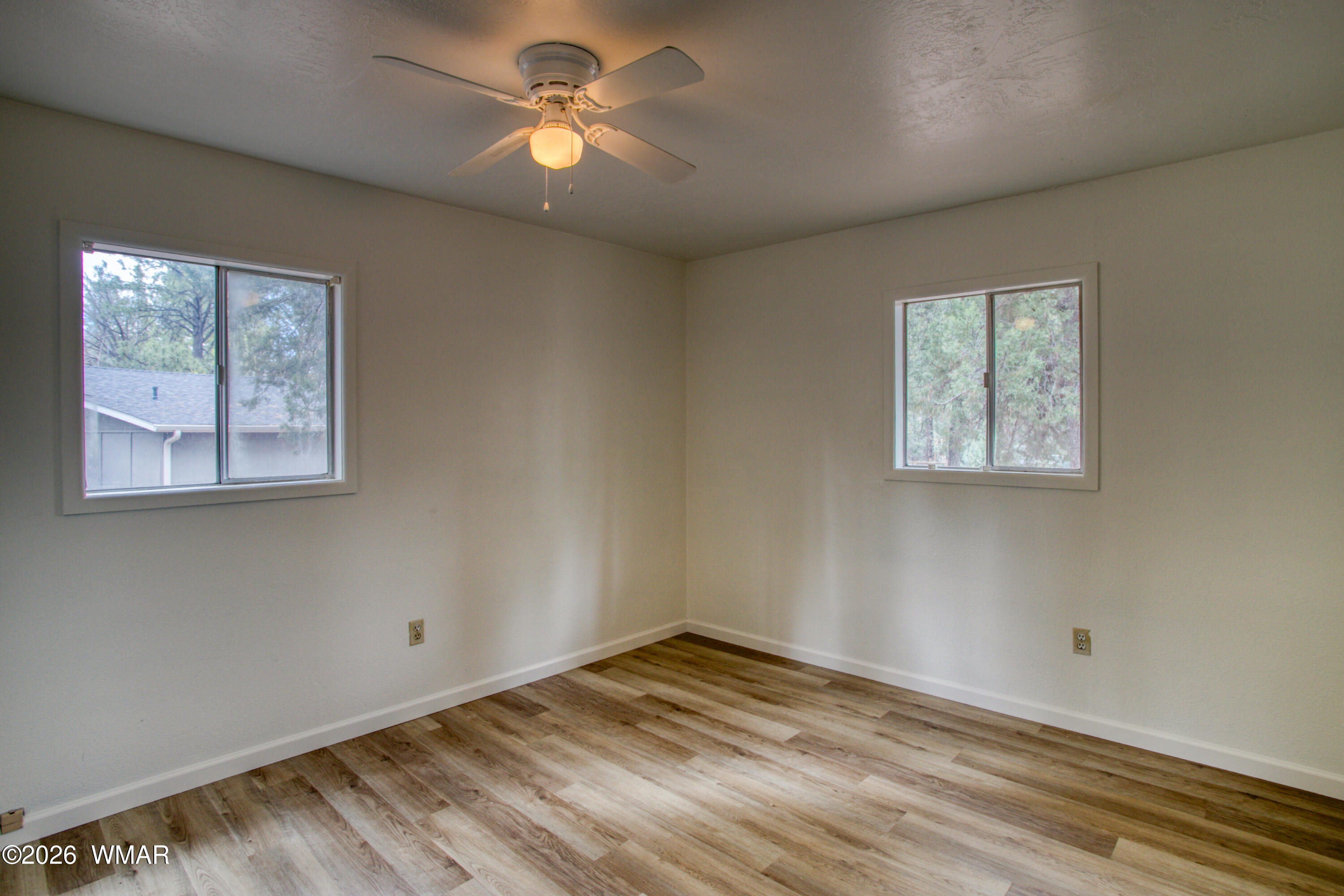 94 Southlake Road Lakeside, AZ 85929 - Photo 4 of 16 a view of empty room with wooden floor and fan
