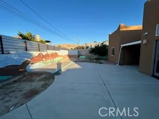 a kitchen with stainless steel appliances granite countertop a refrigerator a oven and a sink