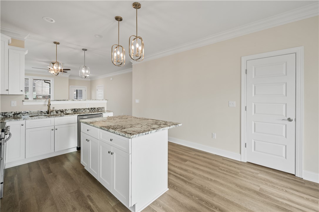 112 Oak Grove Road Norris, SC 29667 - Photo 9 of 19 This bright kitchen features a functional island and elegant finishes.