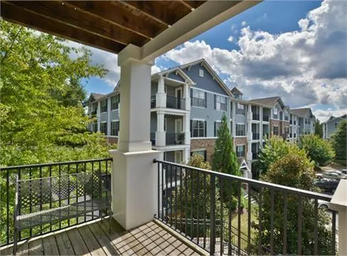 a view of a balcony with city view