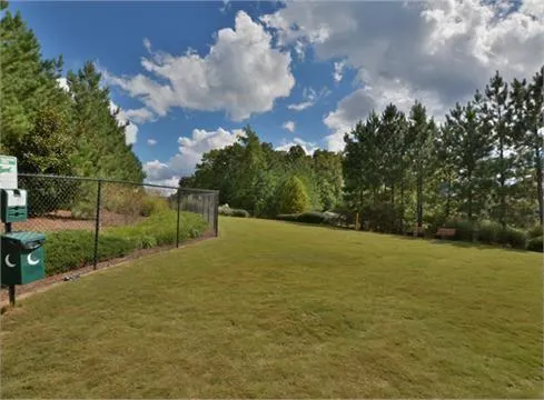 a childrens park with lots of swings and slides