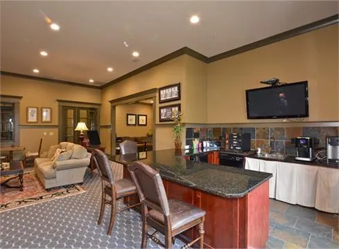 a aerial view of a house with swimming pool