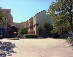 a street view with tall buildings