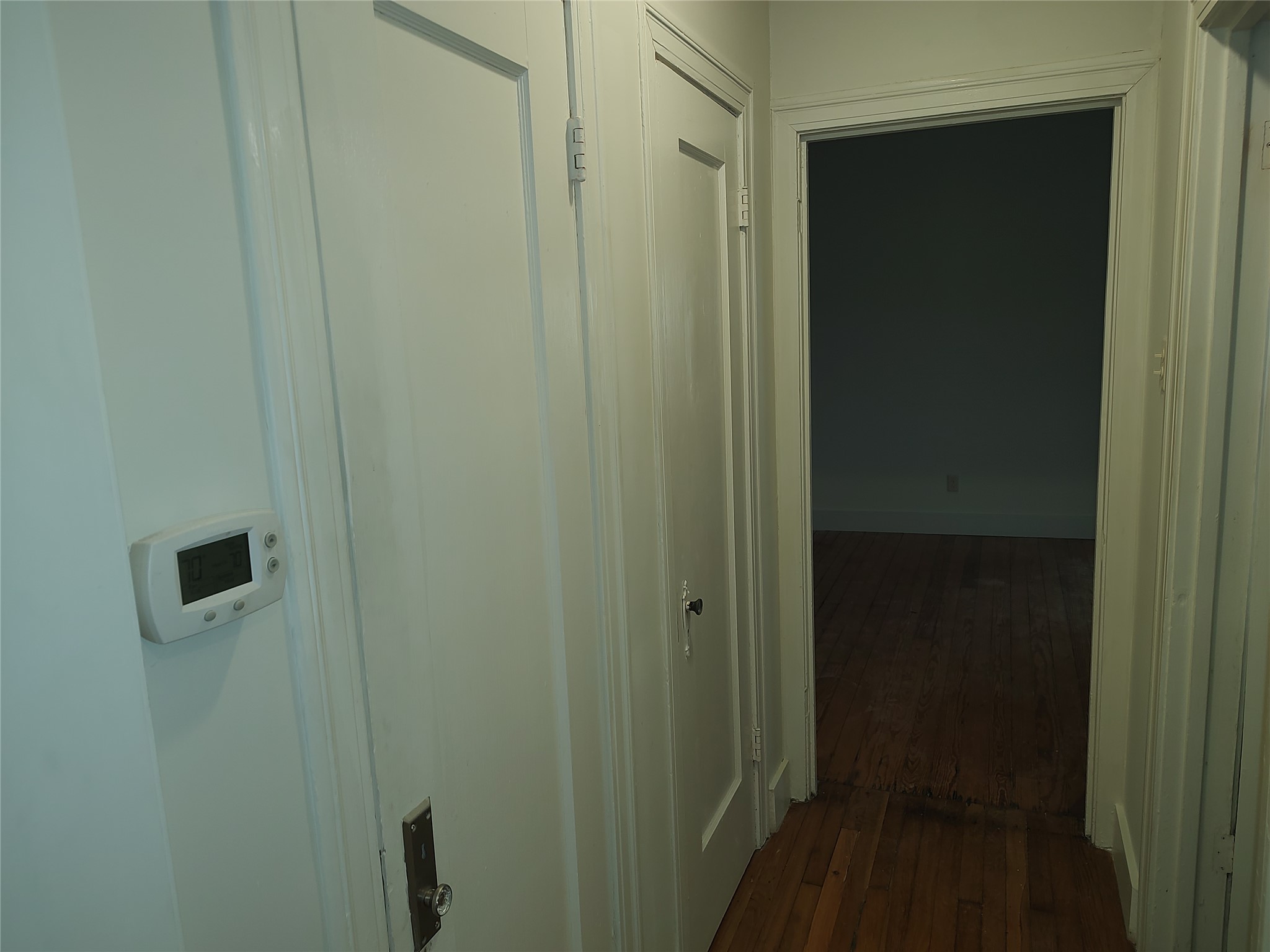 2102 Yellow Jacket Lane, Unit A Austin, TX 78741 - Photo 7 of 15 Hall featuring dark wood-style flooring