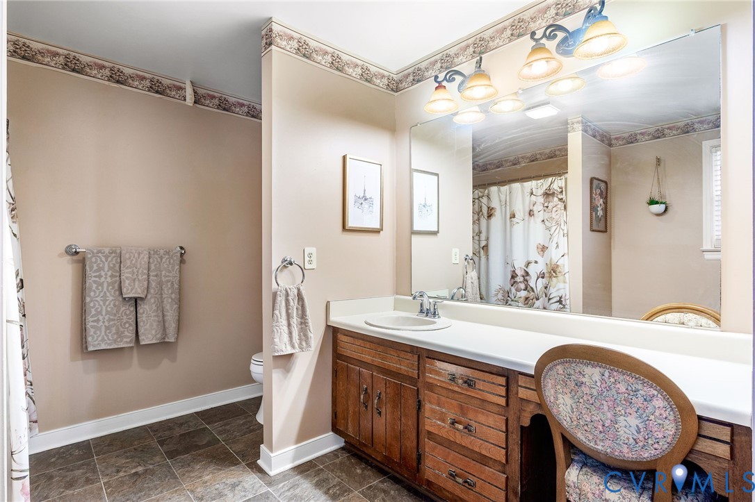 2901 Tipton Street Colonial Heights, VA 23834 - Photo 19 of 29 a spacious bathroom with a sink a mirror a bathtub and a shower