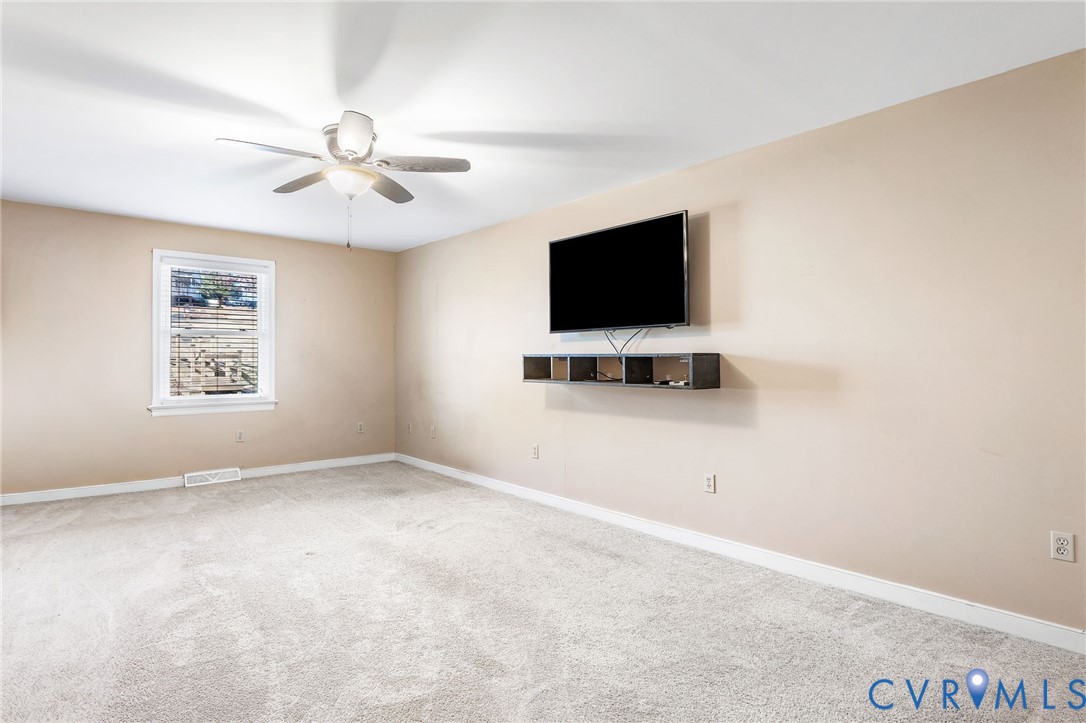 2901 Tipton Street Colonial Heights, VA 23834 - Photo 20 of 29 an empty room with windows and flat screen tv