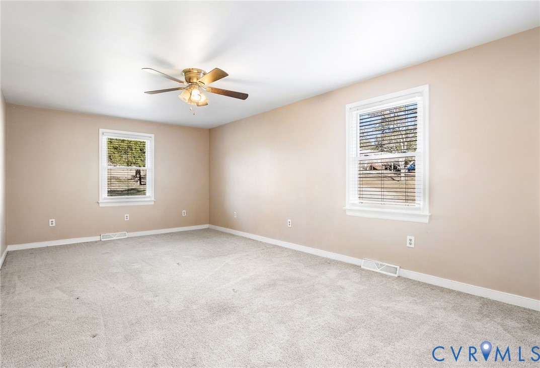 2901 Tipton Street Colonial Heights, VA 23834 - Photo 21 of 29 an empty room with windows and chandelier fan