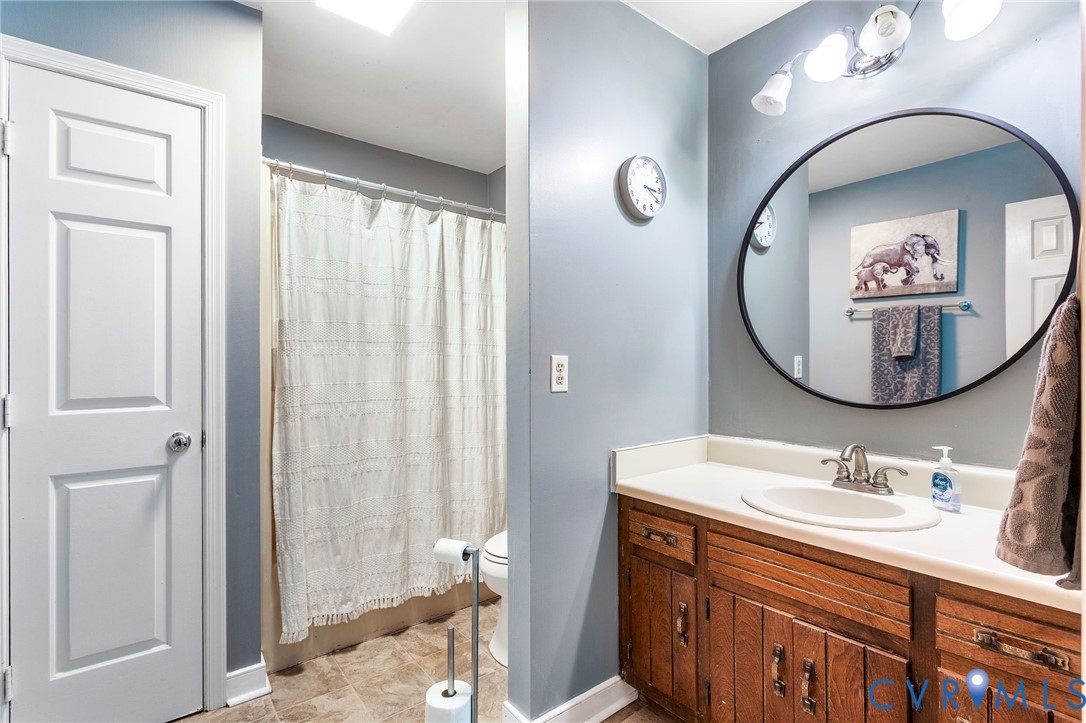 2901 Tipton Street Colonial Heights, VA 23834 - Photo 22 of 29 a bathroom with a sink and a mirror