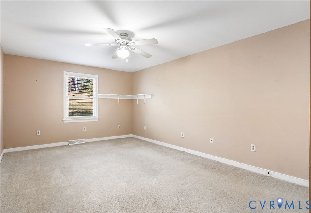 2901 Tipton Street Colonial Heights, VA 23834 - Photo 23 of 29 an empty room with windows and fan