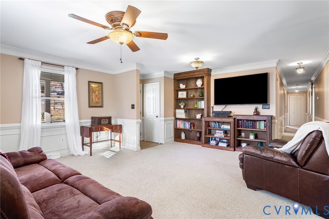 2901 Tipton Street Colonial Heights, VA 23834 - Photo 8 of 29 a living room with furniture and a flat screen tv with wooden floor