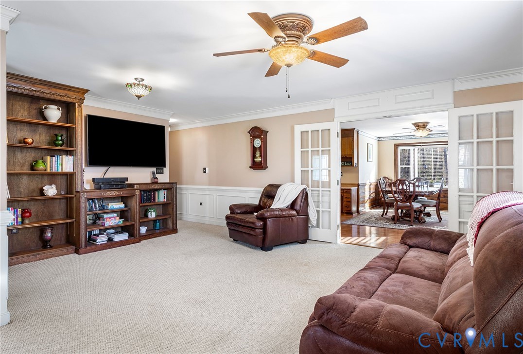 2901 Tipton Street Colonial Heights, VA 23834 - Photo 9 of 29 a living room with furniture and a flat screen tv with kitchen view