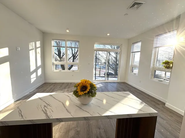 a living room with window and a table