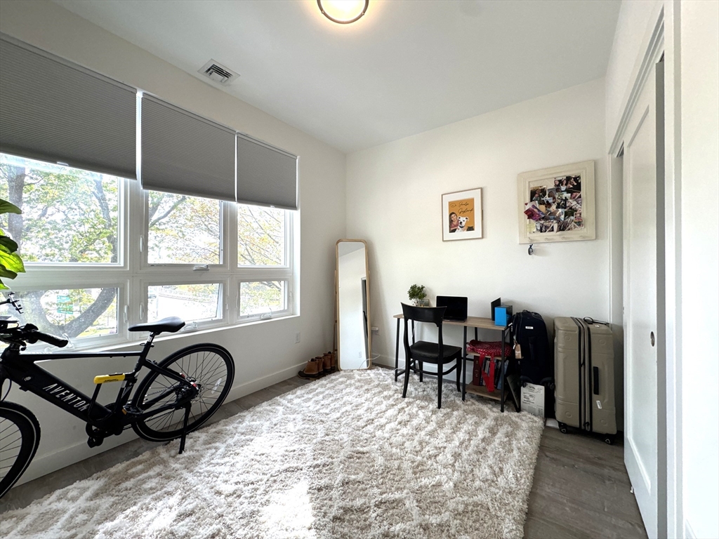 302 Broadway, Unit 303 Everett, MA 02149 - Photo 6 of 11 a view of a workspace with furniture and a window