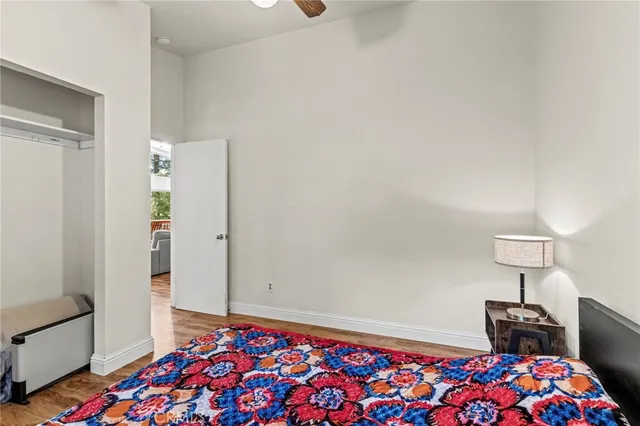 a bathroom with a sink a toilet a mirror and shower