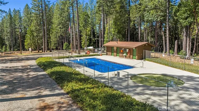 a view of a house with a small yard and wooden floor