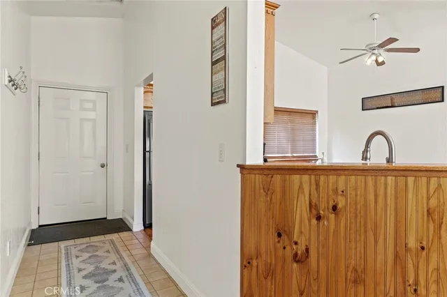 a kitchen with stainless steel appliances granite countertop a refrigerator a stove and a sink