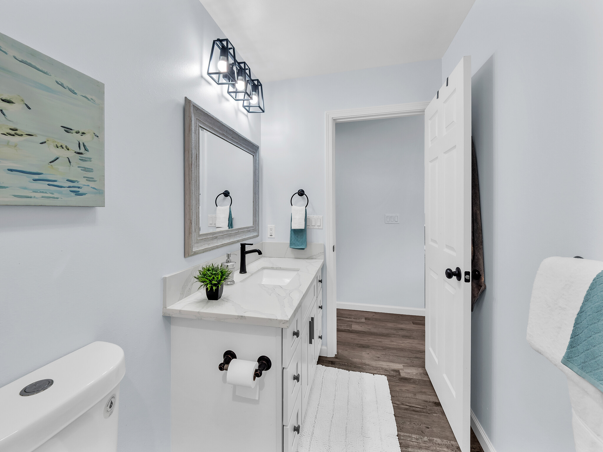 11-2789 Hibiscus Street Mountain View, HI 96771 - Photo 18 of 30 a bathroom with a sink mirror and toilet