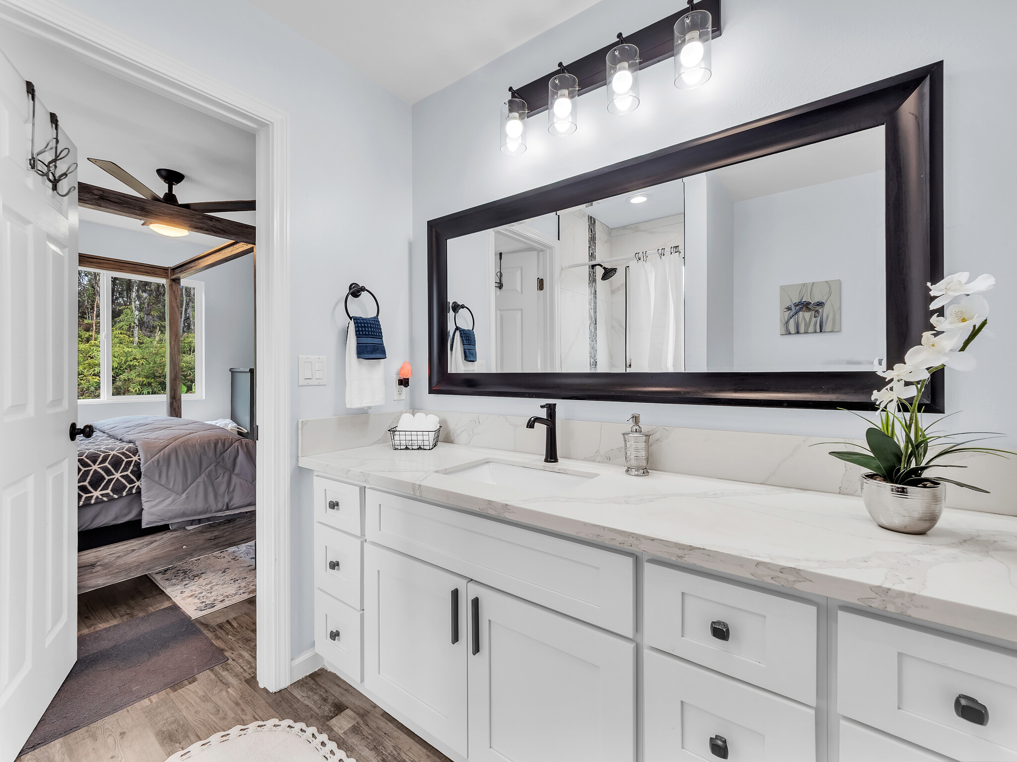 11-2789 Hibiscus Street Mountain View, HI 96771 - Photo 22 of 30 a bathroom with a double vanity sink and a mirror