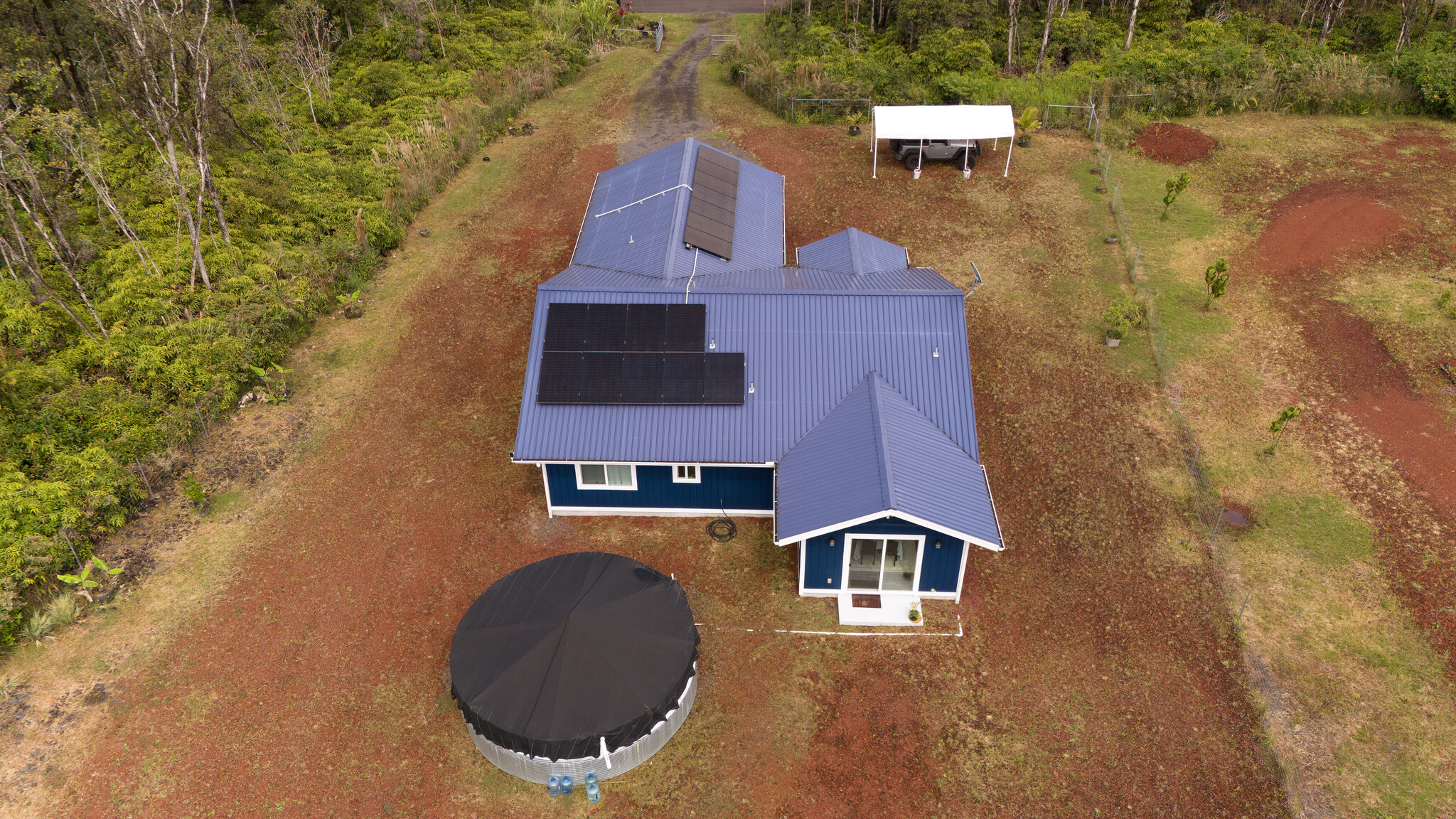 11-2789 Hibiscus Street Mountain View, HI 96771 - Photo 4 of 30 an aerial view of a house with a yard and balcony