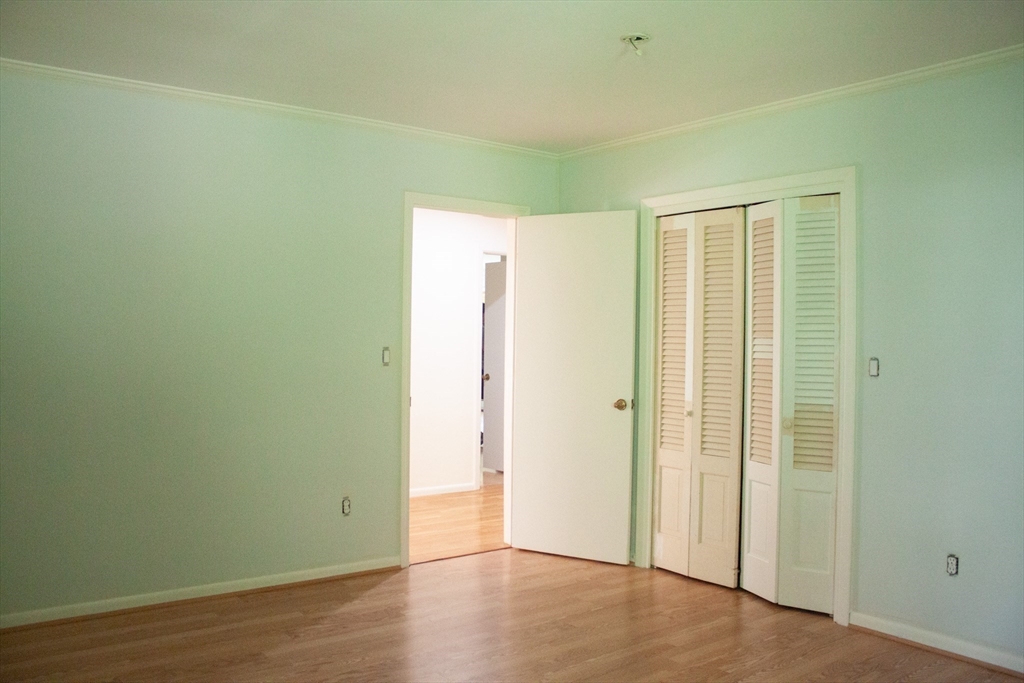 13 Montclair Drive Worcester, MA 01609 - Photo 13 of 38 an empty room with wooden floor and windows