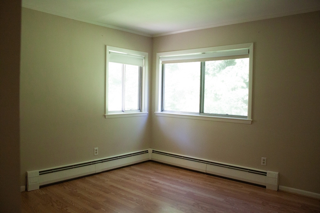13 Montclair Drive Worcester, MA 01609 - Photo 14 of 38 a view of an empty room with wooden floor and a window