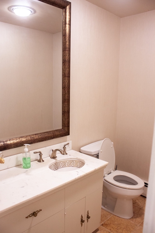 13 Montclair Drive Worcester, MA 01609 - Photo 17 of 38 a bathroom with a sink a toilet and mirror