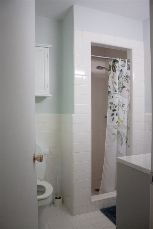 13 Montclair Drive Worcester, MA 01609 - Photo 21 of 38 a bathroom with a shower and toilet