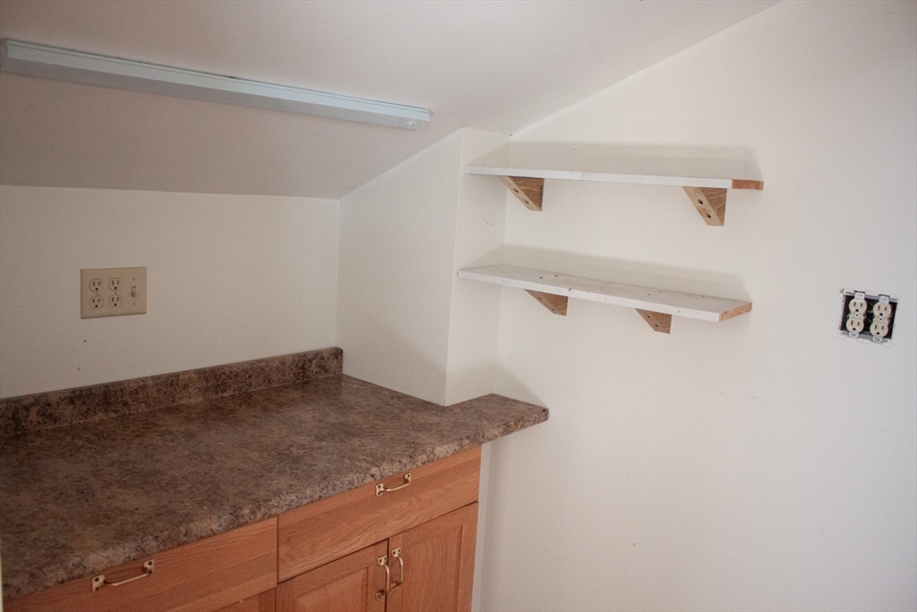 13 Montclair Drive Worcester, MA 01609 - Photo 29 of 38 a kitchen with a sink and cabinets