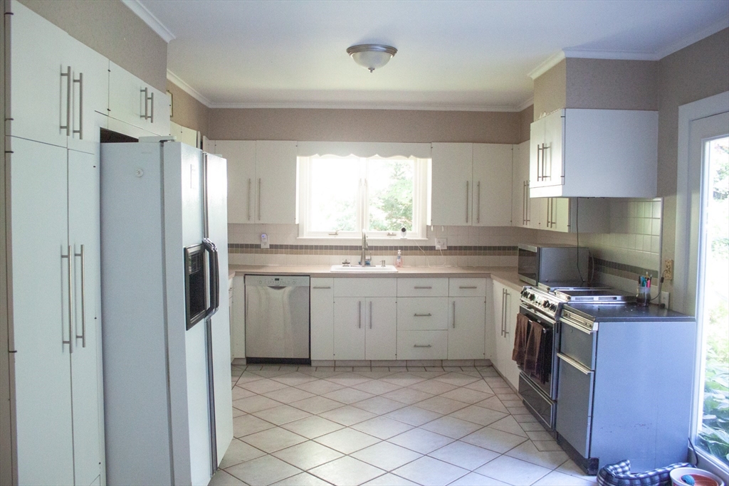 13 Montclair Drive Worcester, MA 01609 - Photo 3 of 38 a kitchen with a sink stove and refrigerator