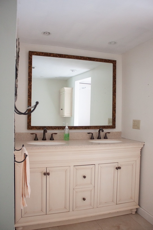 13 Montclair Drive Worcester, MA 01609 - Photo 31 of 38 a bathroom with a granite countertop sink vanity and mirror