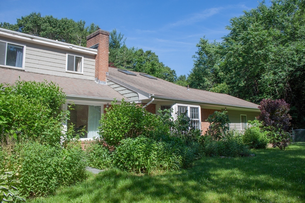 13 Montclair Drive Worcester, MA 01609 - Photo 37 of 38 a view of backyard with potted plants and large tree