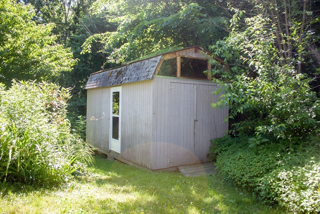 13 Montclair Drive Worcester, MA 01609 - Photo 38 of 38 a backyard of a house with plants and tree