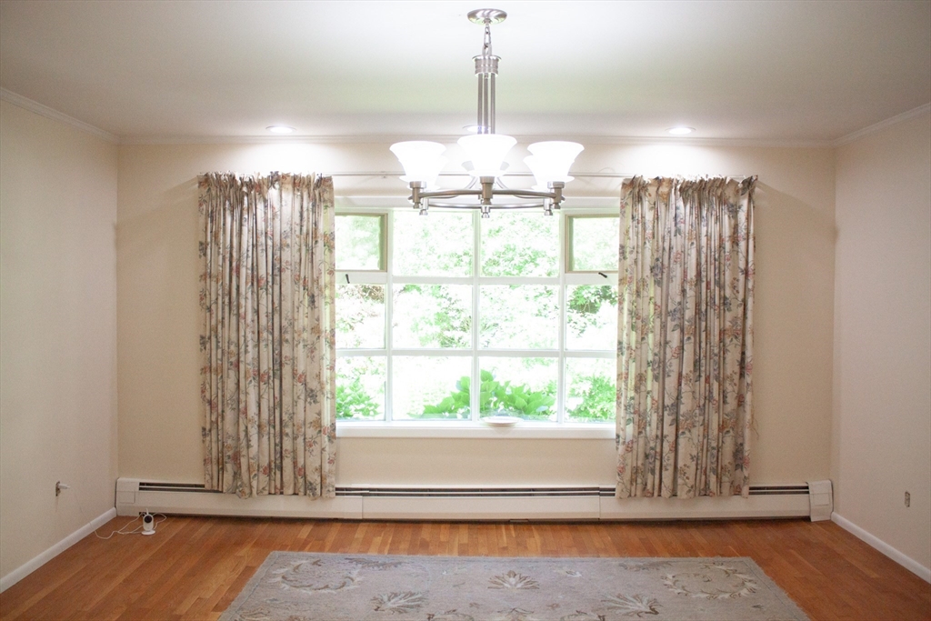 13 Montclair Drive Worcester, MA 01609 - Photo 6 of 38 a view of a room with wooden floor chandelier and windows