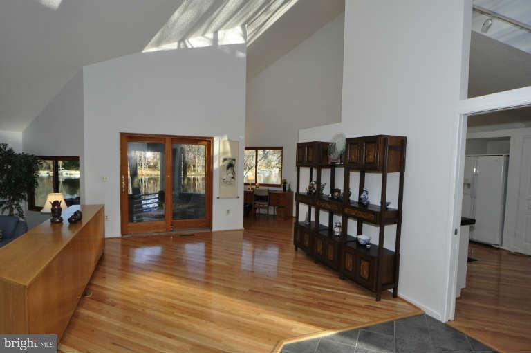 2260 Compass Point Lane Reston, VA 20191 - Photo 5 of 23 a hallway with wooden floor and furniture