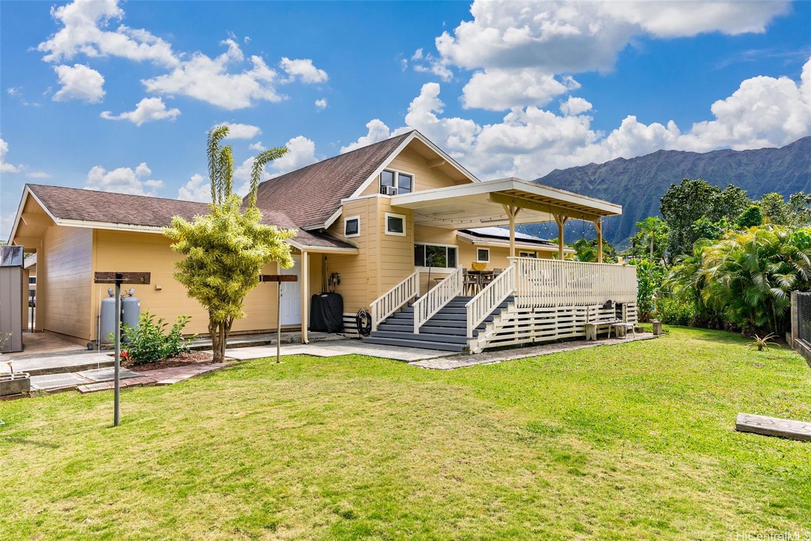 a front view of a house with garden