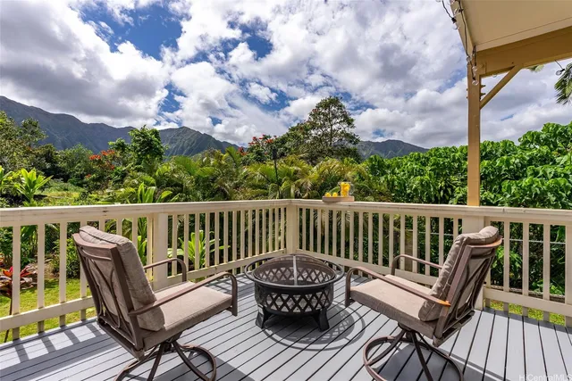 a front view of a house with a yard table and chairs