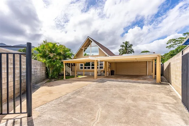 a view of house with outdoor space in front of it