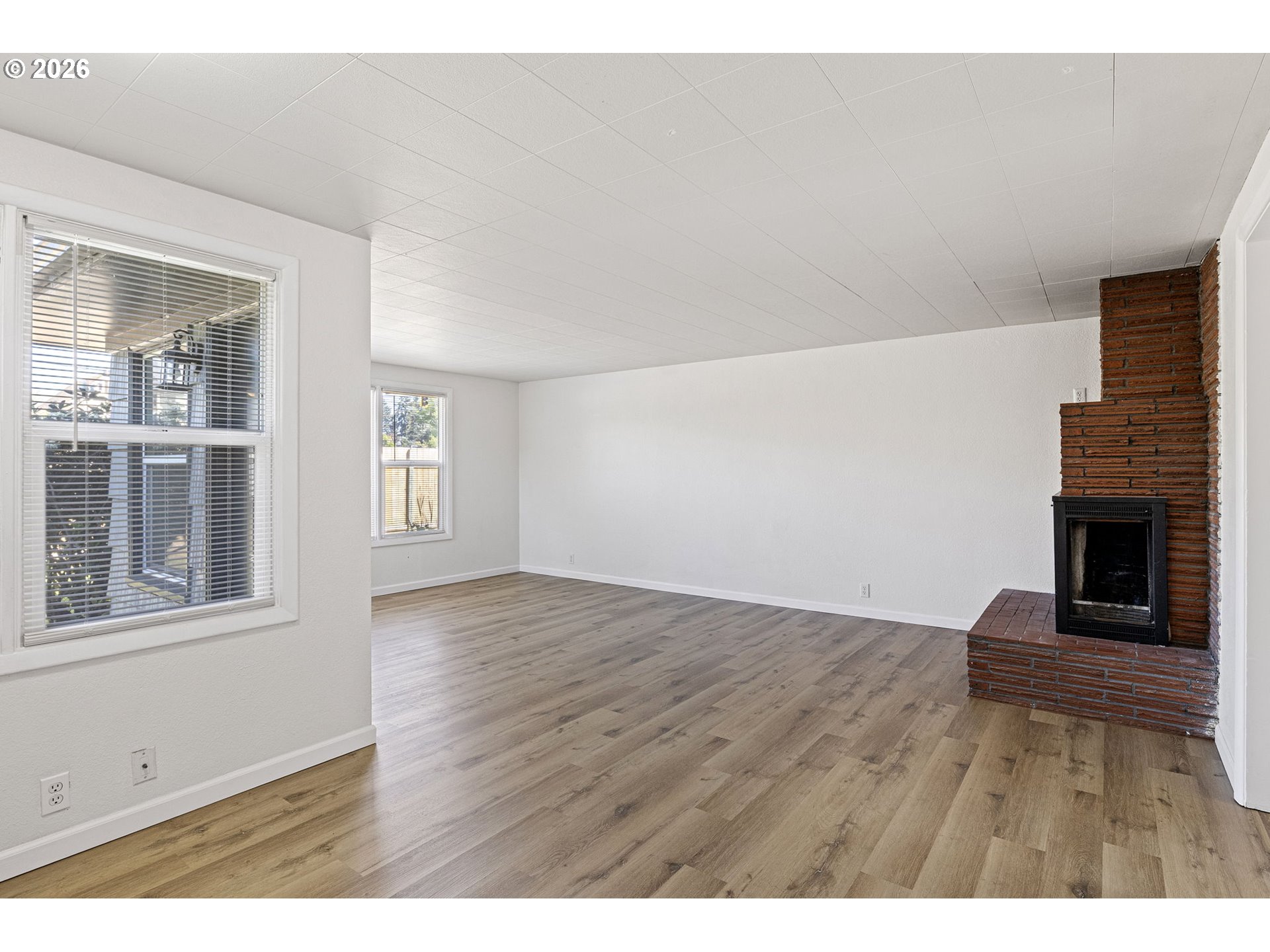 1008 Coburg Road Eugene, OR 97401 - Photo 32 of 46 a view of an empty room with window and fire place