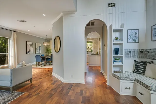 a view of living room and kitchen with wooden floor