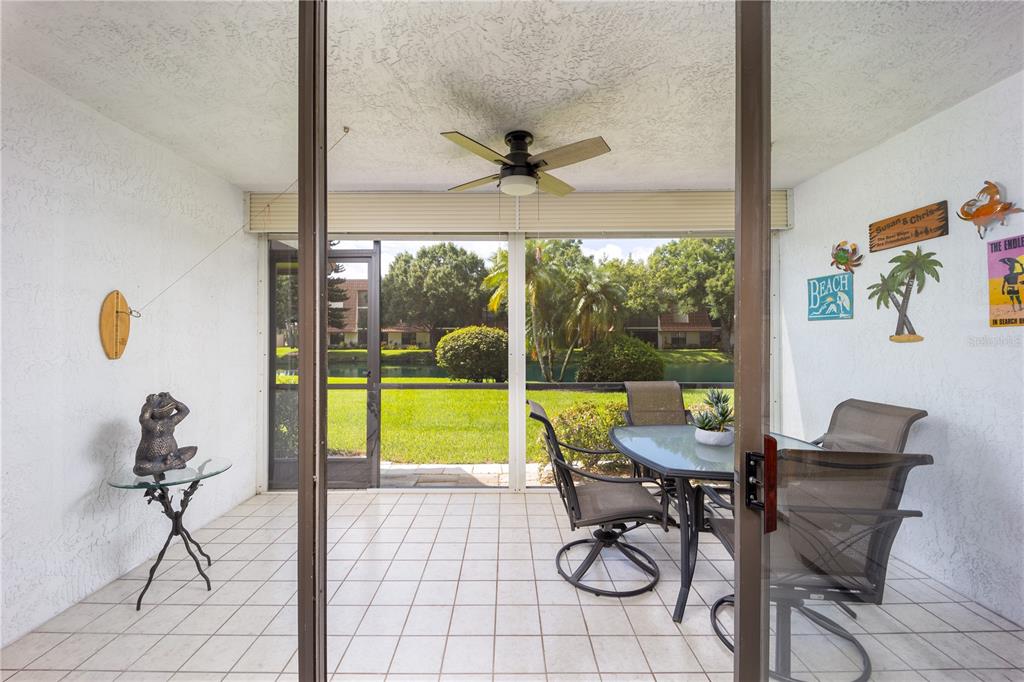 3100 Southeast Pruitt Road, Unit B102 Port St. Lucie, FL 34952 - Photo 24 of 33 a view of a livingroom with furniture and a floor to ceiling window
