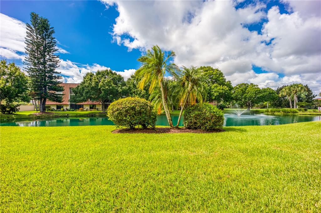3100 Southeast Pruitt Road, Unit B102 Port St. Lucie, FL 34952 - Photo 28 of 33 a view of a garden and basketball court