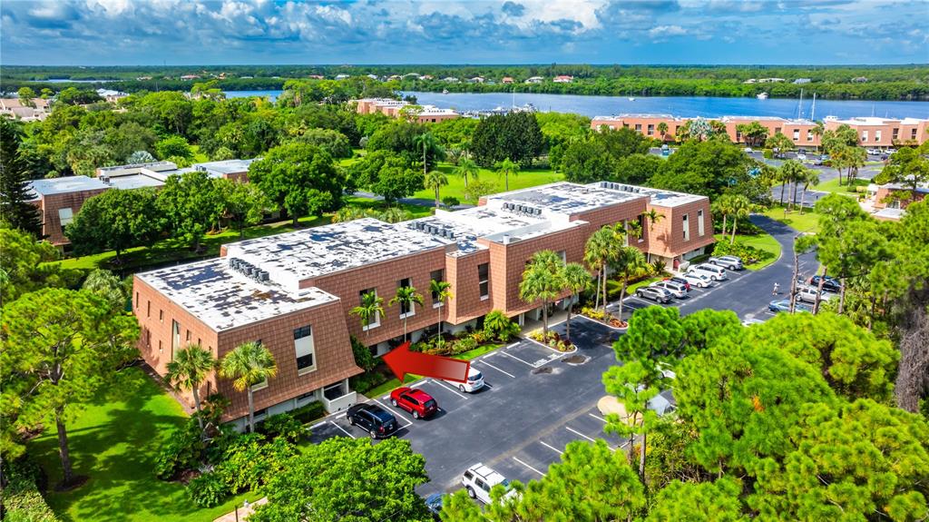 3100 Southeast Pruitt Road, Unit B102 Port St. Lucie, FL 34952 - Photo 5 of 33 an aerial view of a house with garden space and outdoor seating