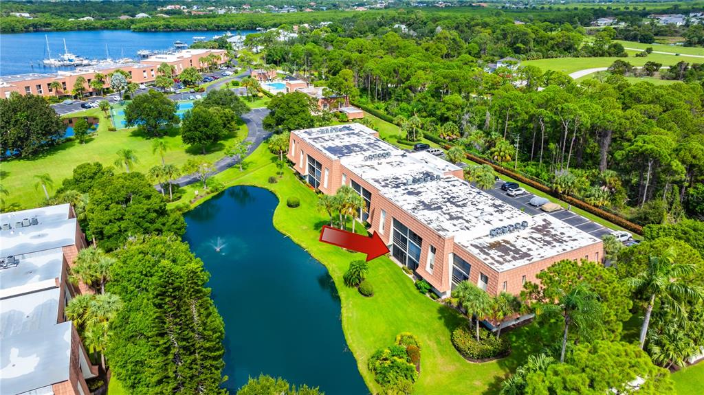 3100 Southeast Pruitt Road, Unit B102 Port St. Lucie, FL 34952 - Photo 7 of 33 an aerial view of a pool