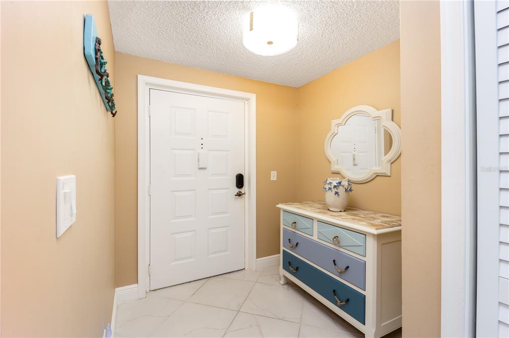3100 Southeast Pruitt Road, Unit B102 Port St. Lucie, FL 34952 - Photo 10 of 33 a room with mirror and a sink