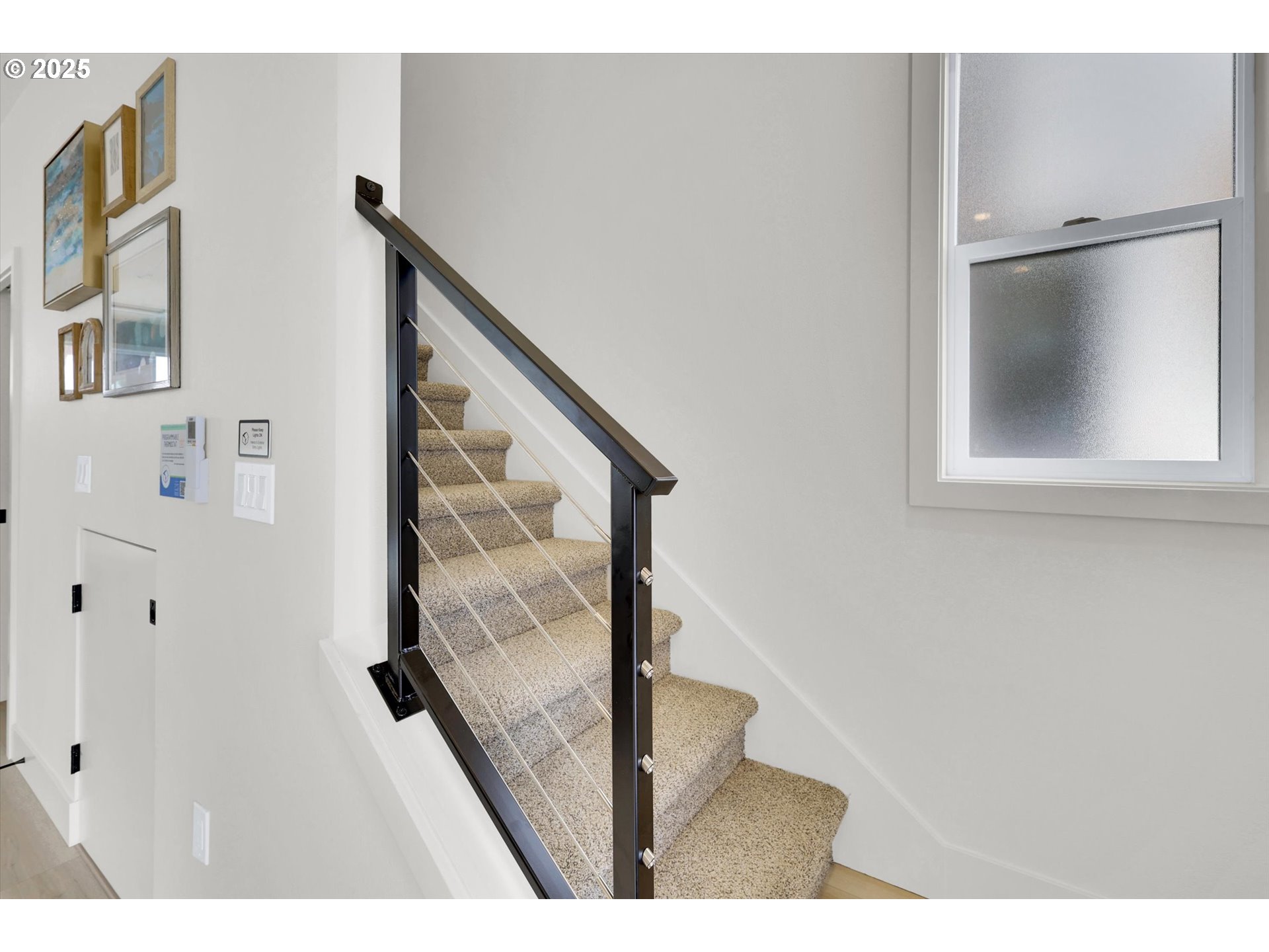 5773 South Kelly Avenue Portland, OR 97239 - Photo 17 of 33 a view of a hallway with wooden floor and staircase