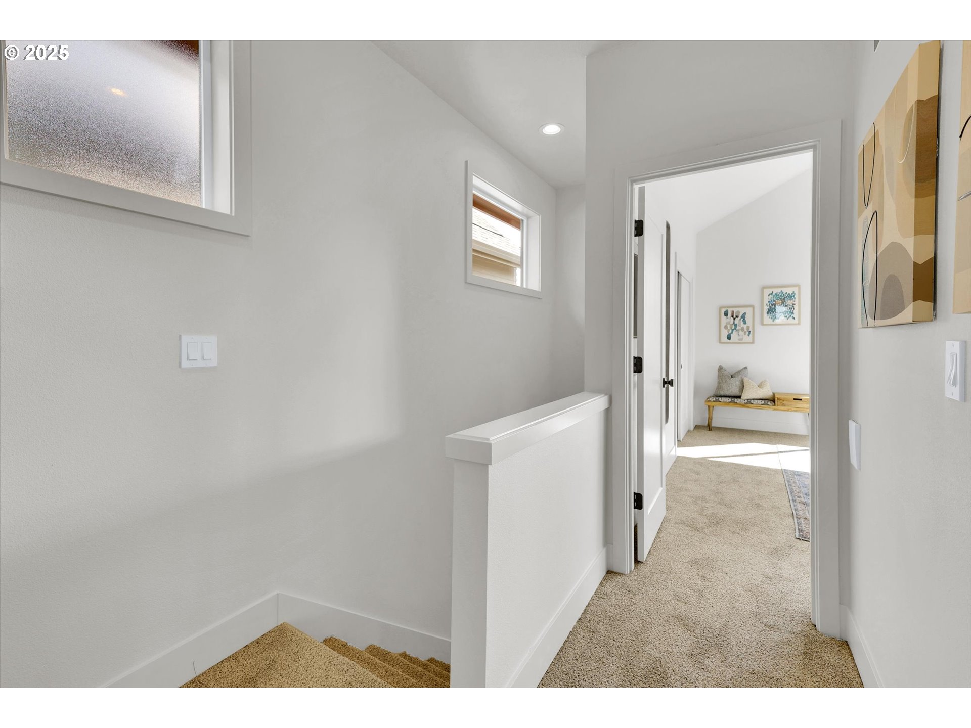 5773 South Kelly Avenue Portland, OR 97239 - Photo 18 of 33 a view of a hallway with wooden floor and windows